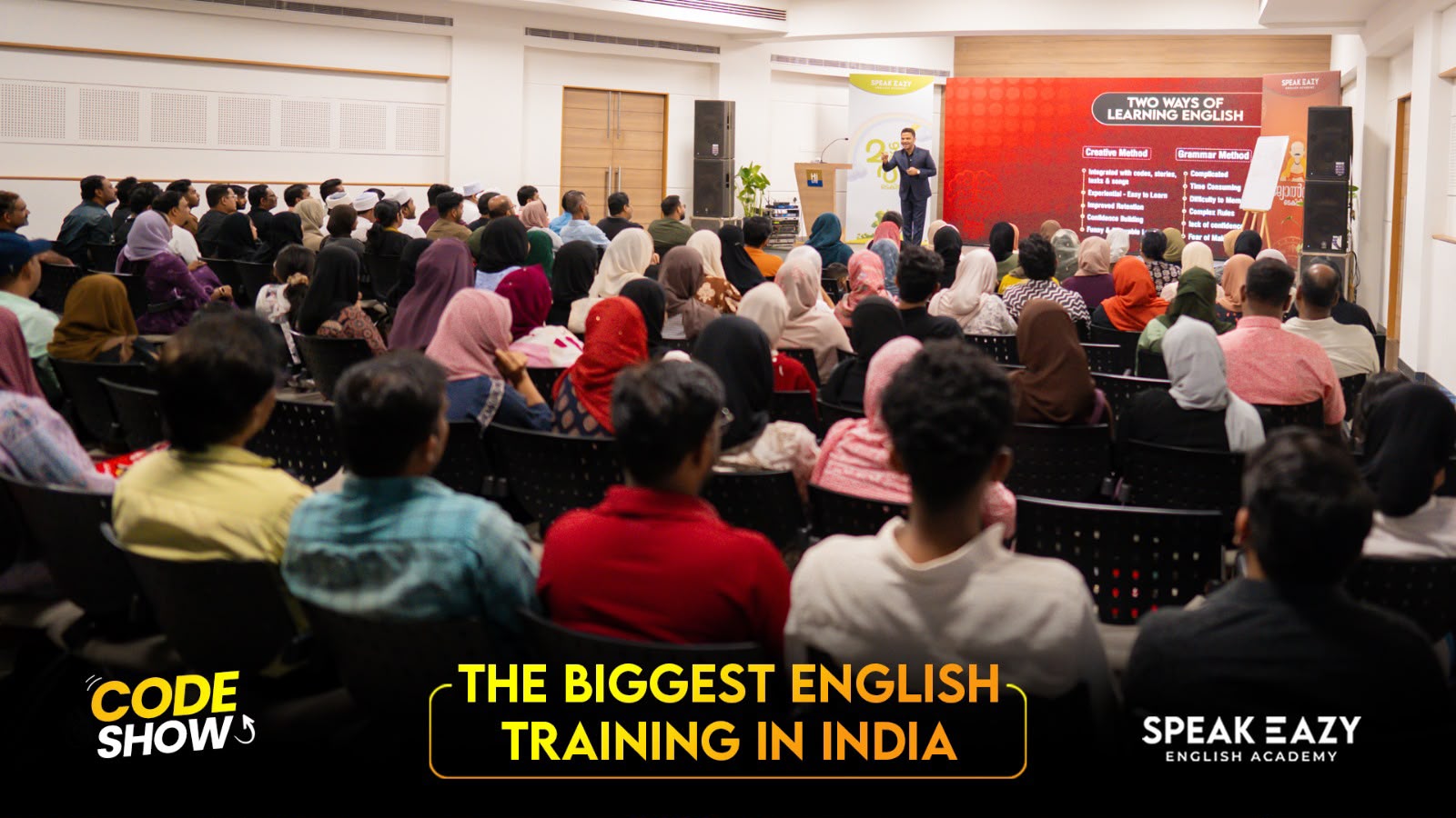 Large audience attending a CODE SHOW training session
