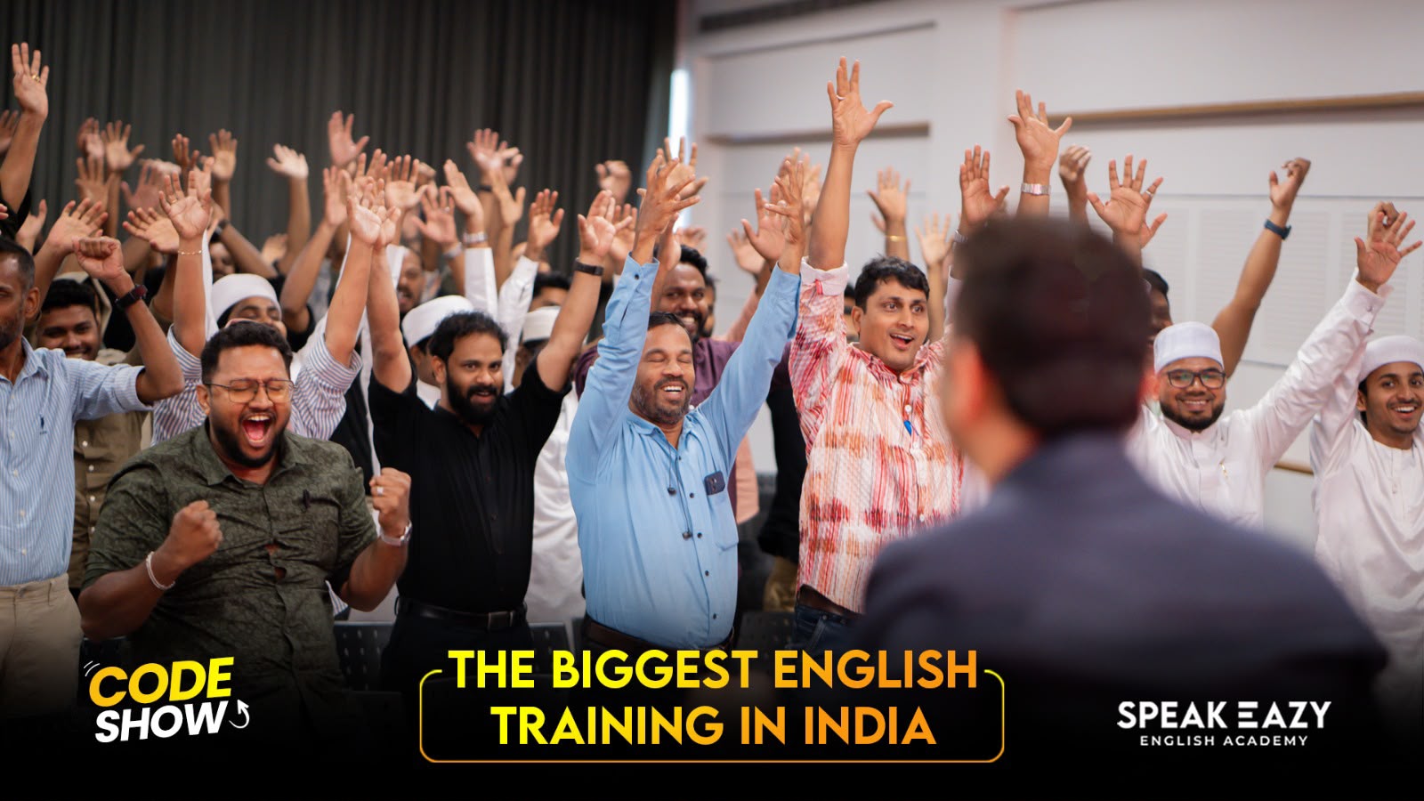 Students with hands raised during a CODE SHOW activity